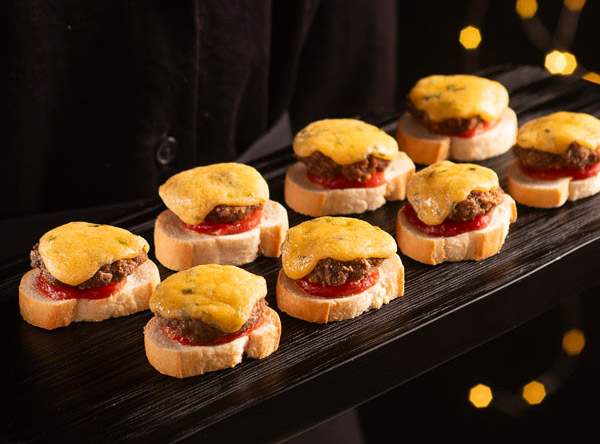 New Years Eve Catering Cheeseburger Crostini On Tray